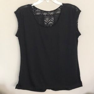 Beautiful black top with crochet on mesh detail.